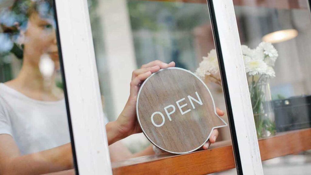 open sign being set in window