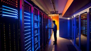 man in data center in dark