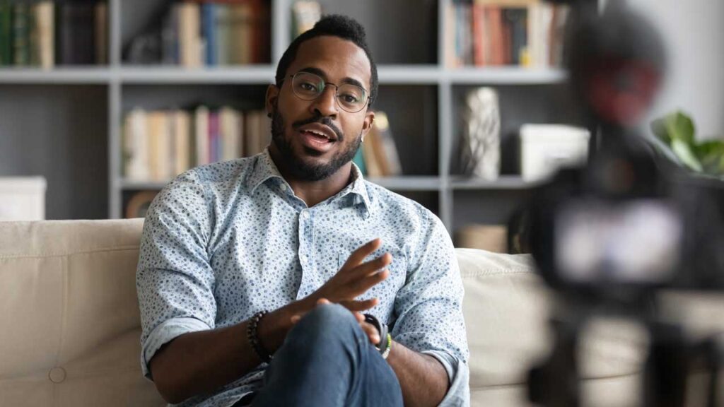 black man talking to camera