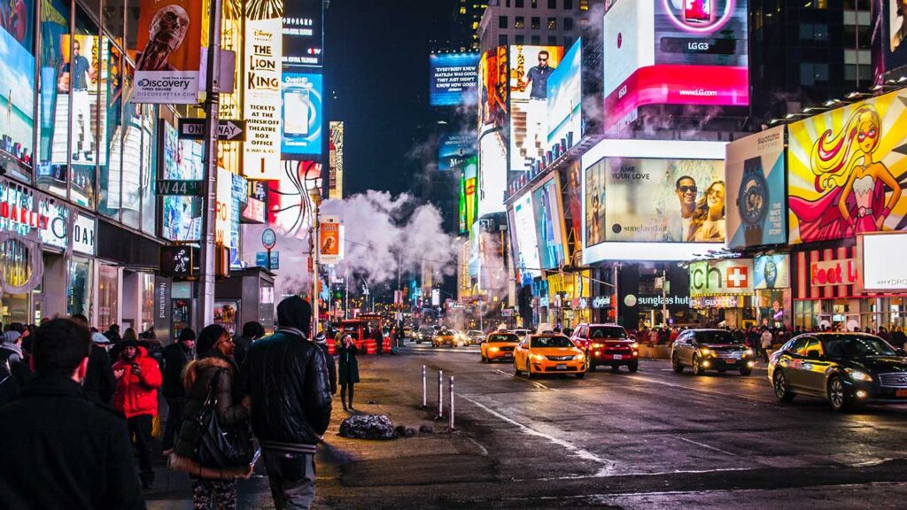 digital billboards in city at night