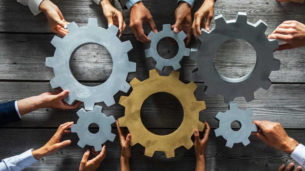 photo of people holding cogs