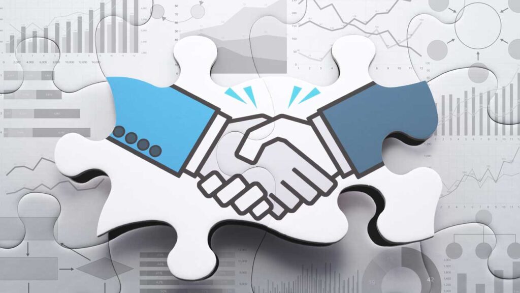 puzzle pieces showing a handshake
