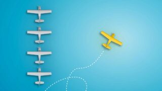 column of planes with one veering off