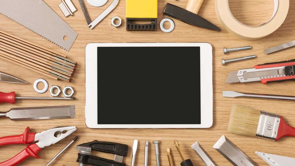 digital pad surrounded by tools