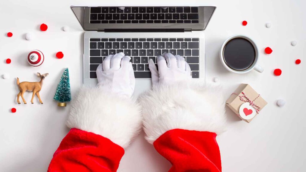 hands of santa typing on keyboard