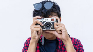 person with vintage camera
