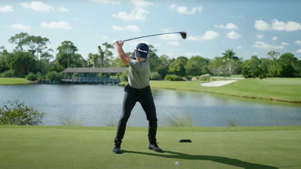 golfer swinging on course