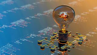 image of lightbulb on screen of code