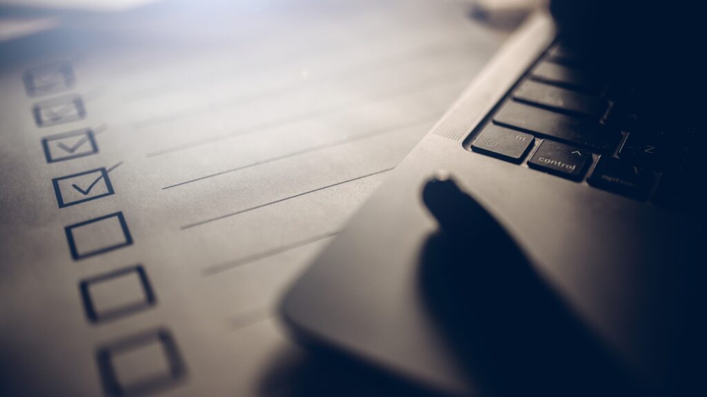 edge of keyboard next to checklist