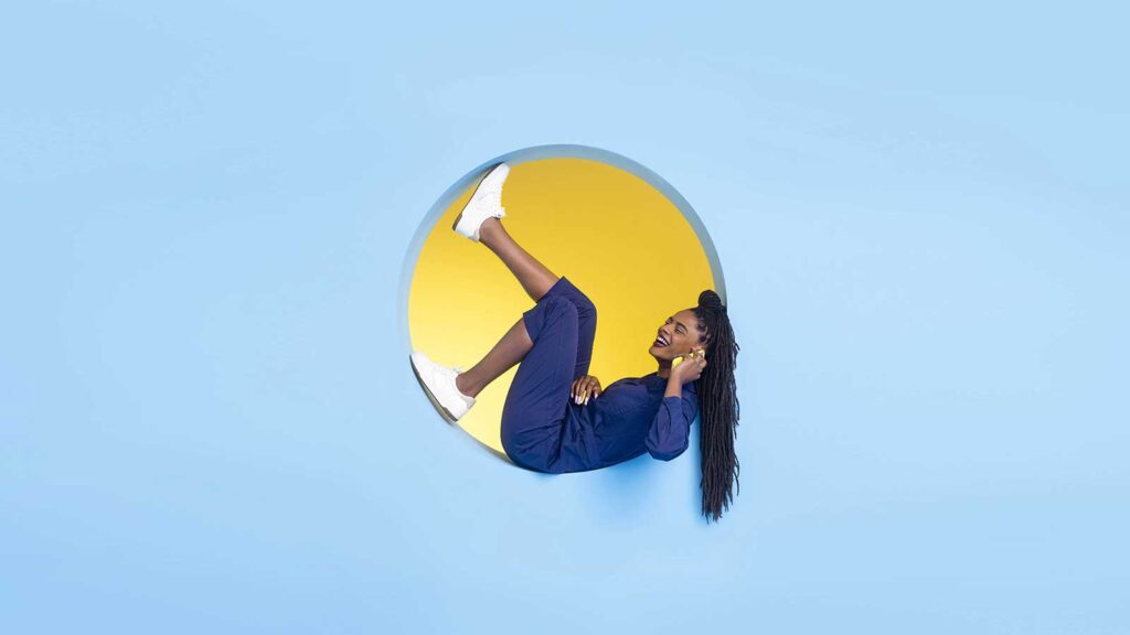 black woman in circle wall shelf talking on phone