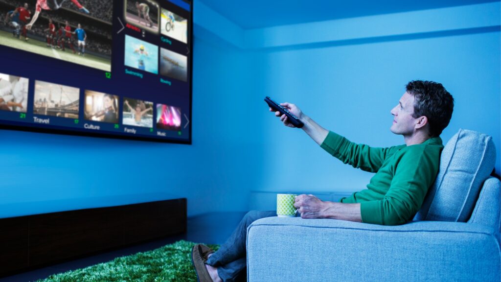 man watching television in living room