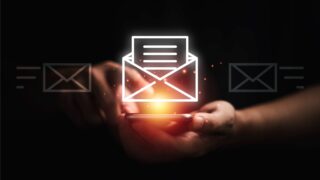 Businessman using smartphone to open e-mail for business contact and communication concept.