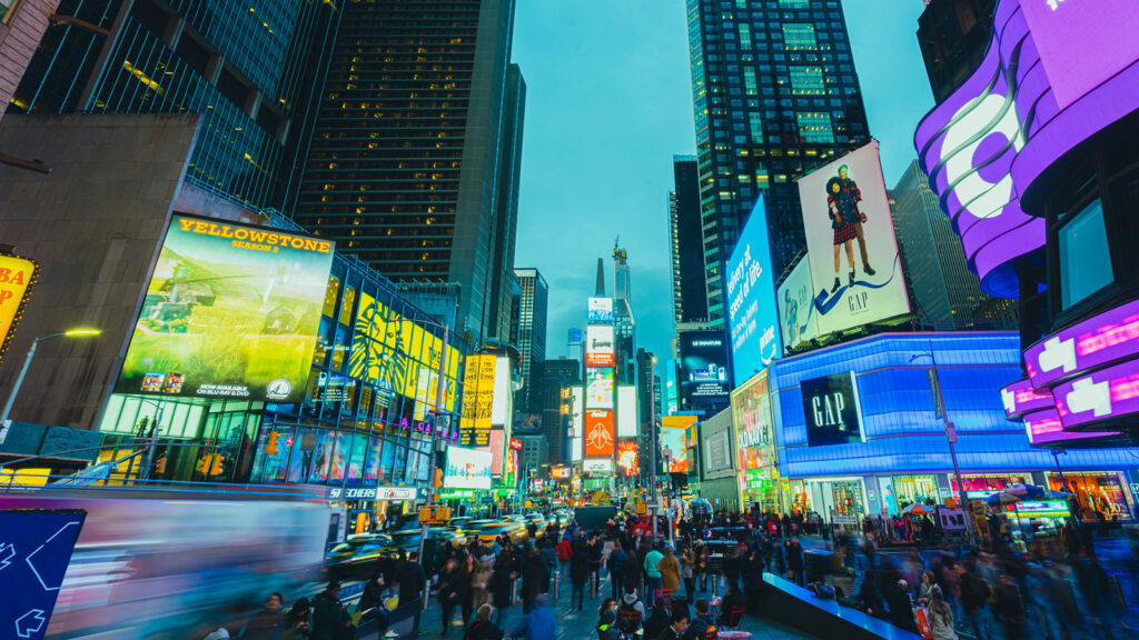 Image of a city block featuring many digital billboards