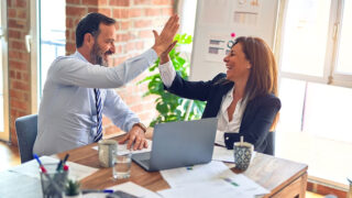 A man and a woman networking for business