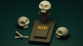 3d skulls on the gravestone with the mark "R.I.P."