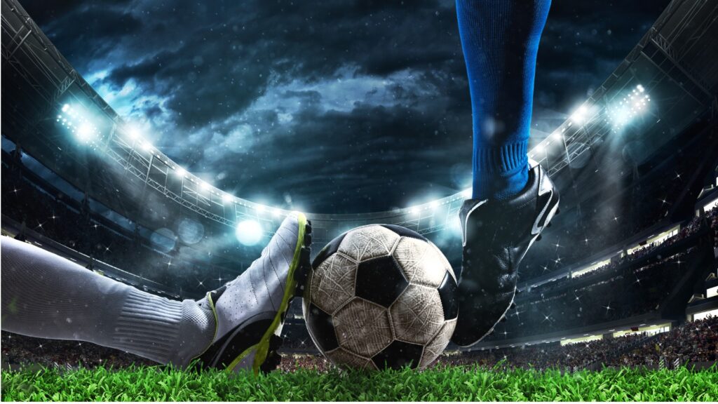 Close up of a football action scene with competing soccer players at the stadium