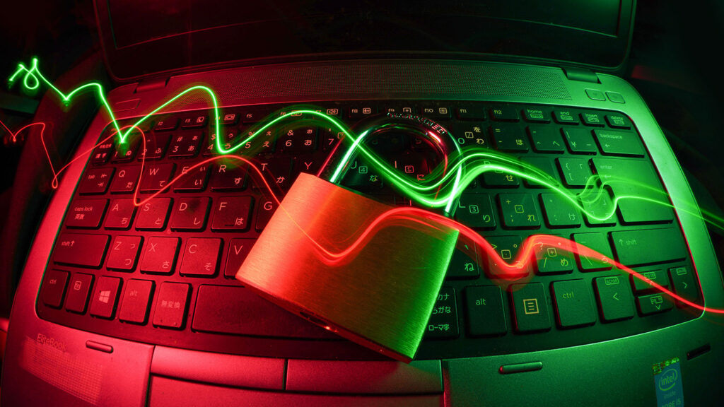Data Security concept photo depicting a laptop with a lock on top of it