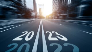 City street with new year number 2023 and 2022 stock photo