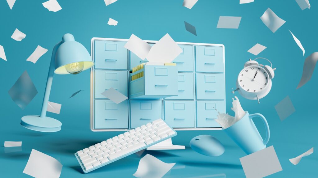 Computer monitor with messy documents stock photo