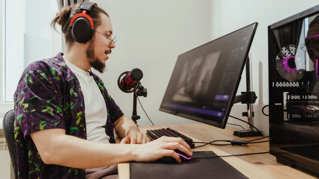 Young stylish man during commenting esports match stream stock photo